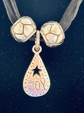 Silver JOY teardrop pendant with star silver heart accent beads on black ribbon